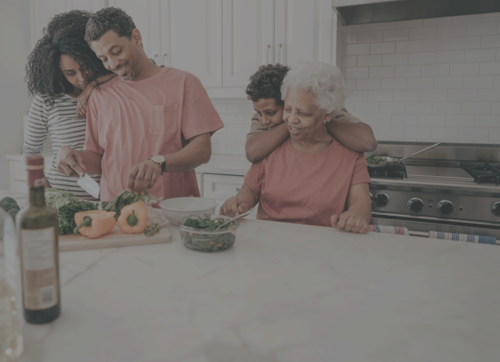 Helping Hands Grande Prairie, family cooking together.